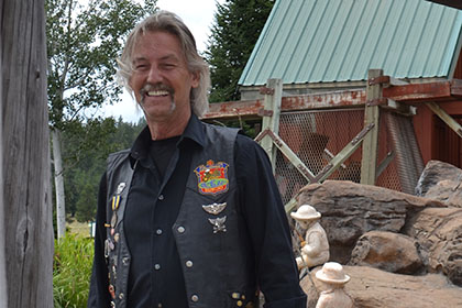 Smiling man wearing his leather chaps.