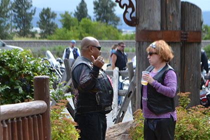 Two people talking near the event entrance.