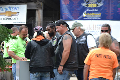 People gathering around Ride for Life committee member.