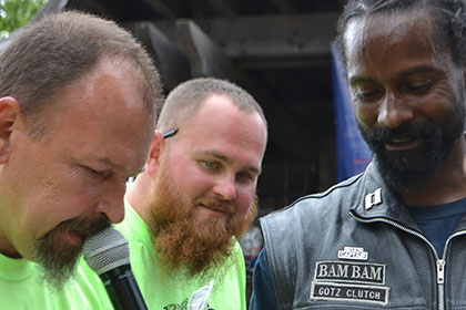 Two Ride for Life committee members and a bearded man.