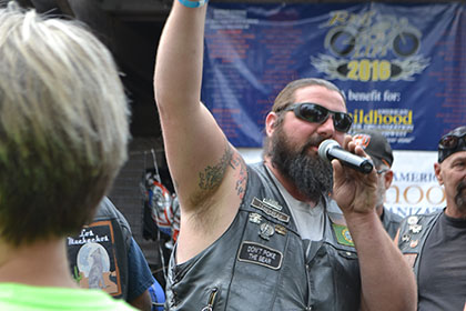 Bearded man on microphone.