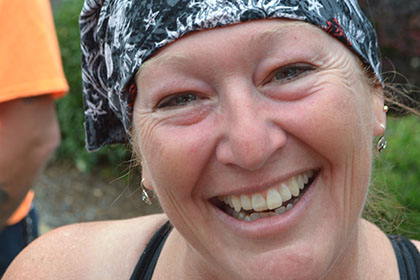 Woman with bandana and sunglasses.