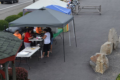 Setting up the barbecue for the event.