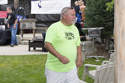 Ride for Life committee member walking on the grass.