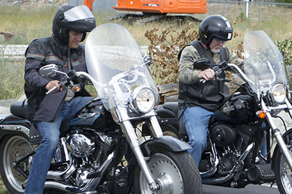 Two men getting ready to ride.