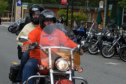 Two people on a motorcycle.