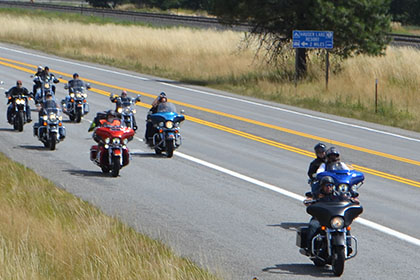 Group of motorcylces on the road.