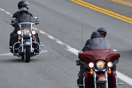 A couple motorcycles on the road.