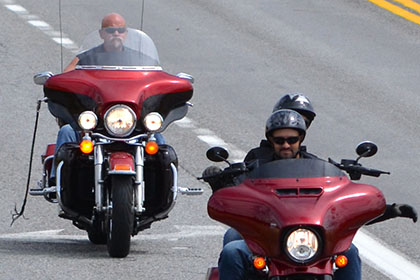Riders on their motorcycles.