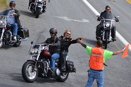 Large group of riders arriving at the event.