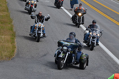 Group of riders arriving at the event.