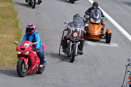 Group of riders arriving at the event.